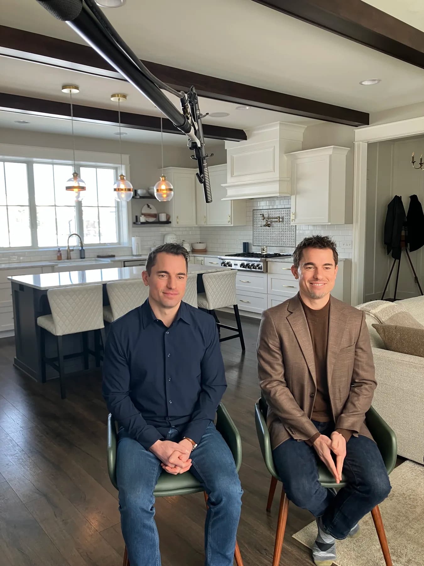 Brian and Derek Boer seated together on set for the Boer Insurance brand story video in West Michigan.