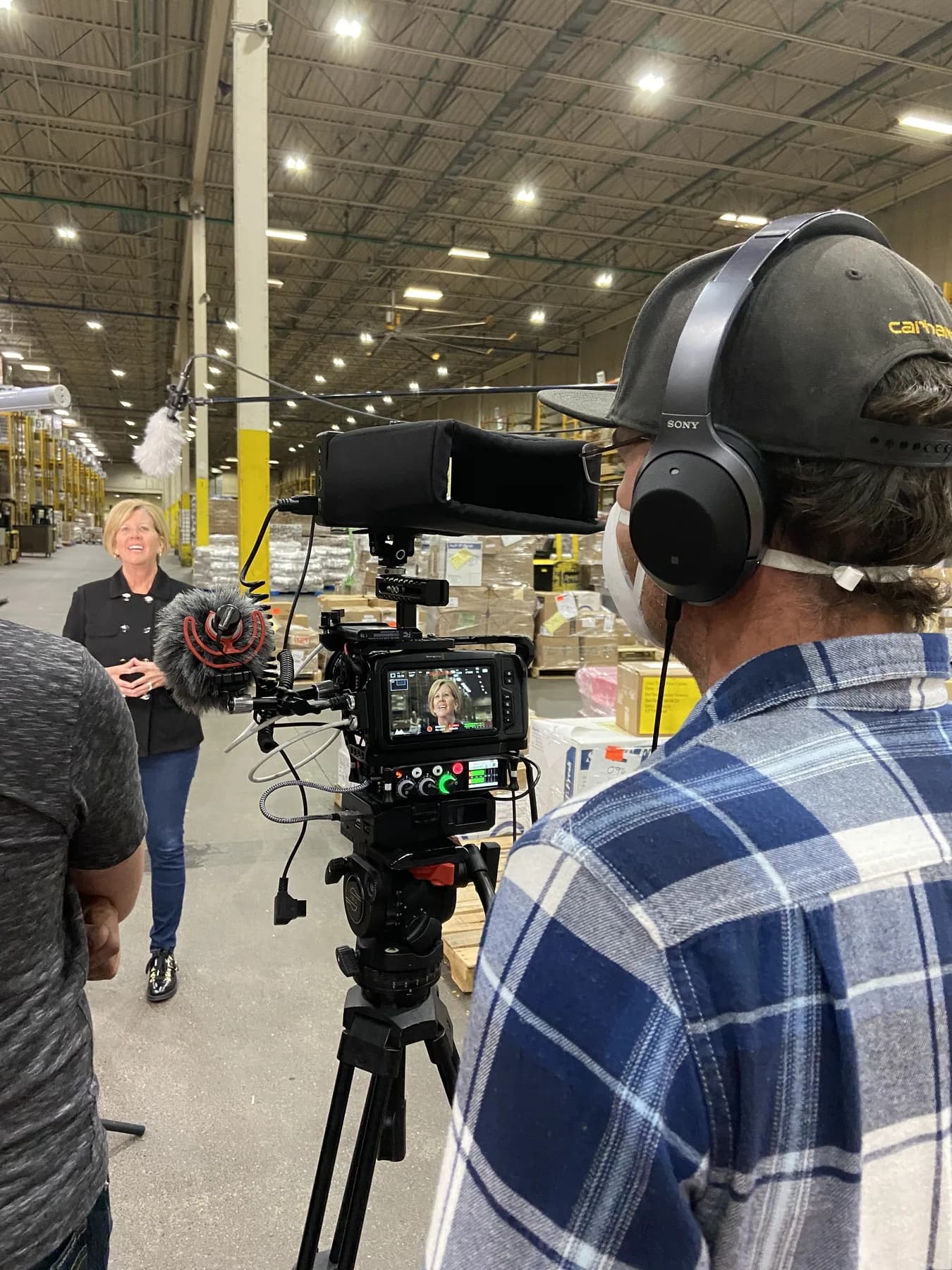 Dawn Bredeweg stands in a SpartanNash warehouse while SALT films her interview for GR Strong.